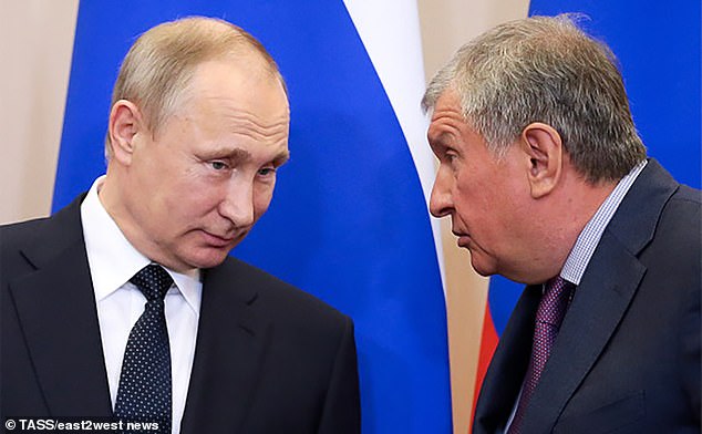 Ivan Sechin was the son of Igor (right), a former spy turned oil tycoon who has known Putin (left) for decades and used to work with him in the St. Petersburg mayor's office.