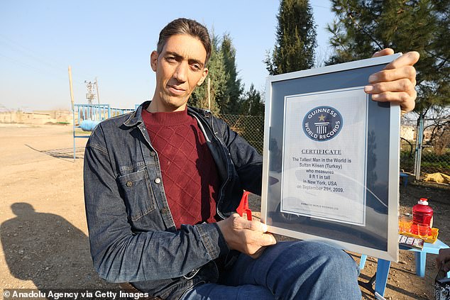 According to Guinness World Records, Kosen is the first person in more than a decade to be taller than 8 feet and is one of 10 confirmed cases in history. He took the record-breaking title in 2009 (pictured above)