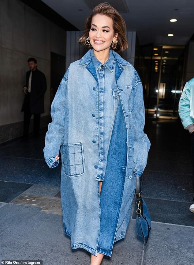 Rita also shared a beautiful picture as she showed off her long legs in a thigh-high denim minidress, underneath an oversized denim coat.