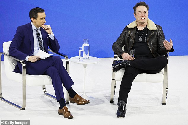 NYT columnist Andrew Ross Sorkin and Elon Musk speak during the New York Times' annual DealBook Summit on November 29, 2023 in New York City.