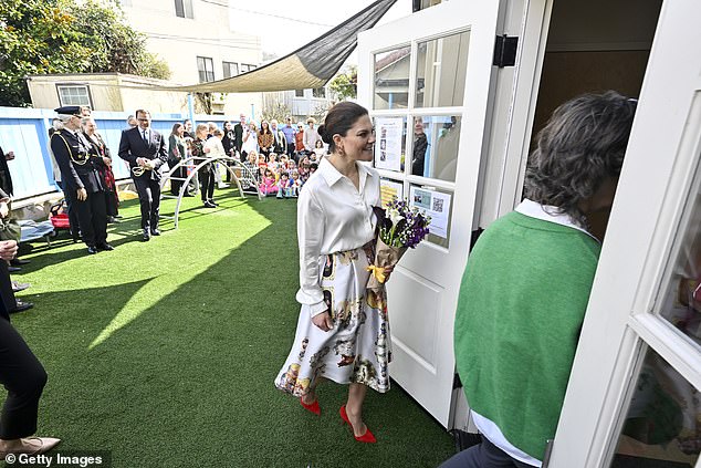 The future Queen of Sweden received a bouquet of flowers after her arrival at the San Francisco school