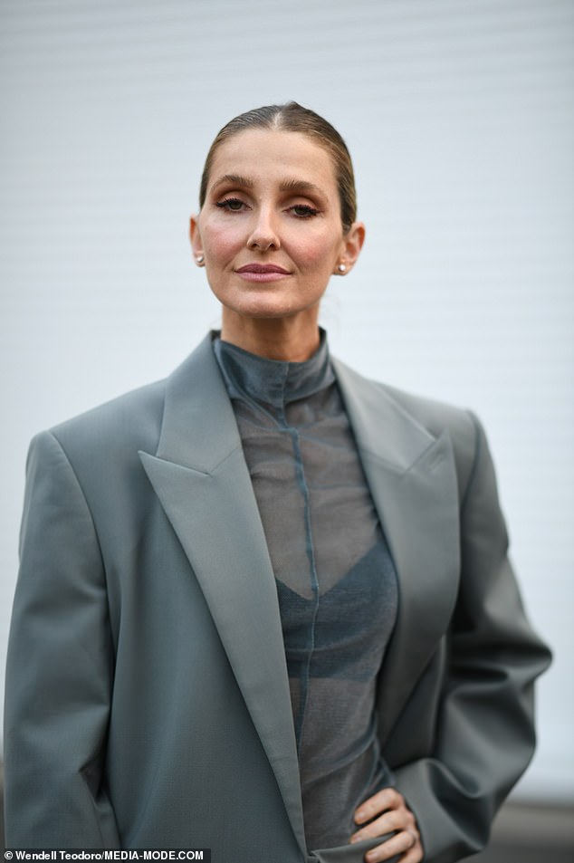 The former Foxtel presenter was the picture of sophistication in a grey-green jacket and matching skirt paired with a sheer blouse underneath.