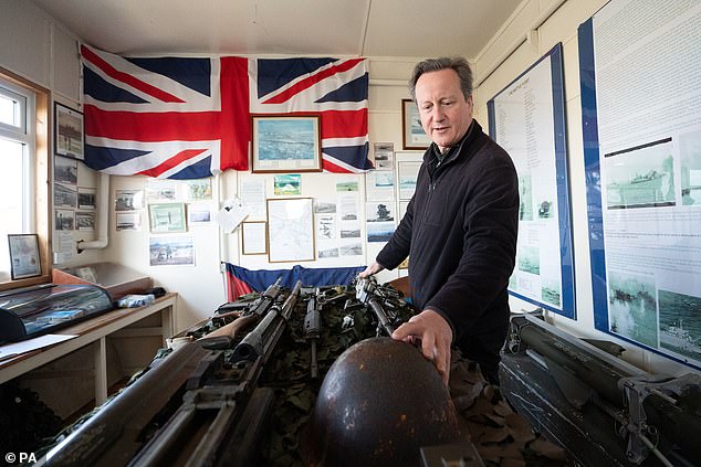 Lord David Cameron visits a museum in Goose Green in the Falkland Islands