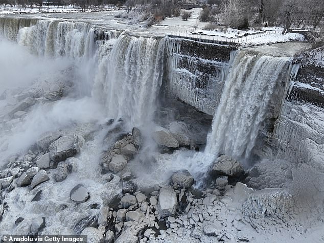 The Niagara falls frozen on the sides due to the cold. An estimated 22 million people visit Niagara Falls each year, on both the American and Canadian sides.
