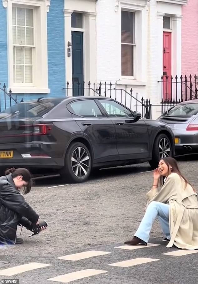 Influencers flit around the neighborhood and lie down in the middle of the road to capture the perfect photo