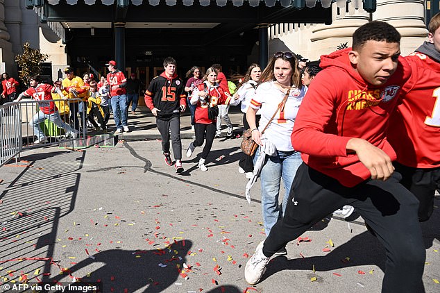 People flee after shots were fired near the Kansas City Chiefs' Super Bowl LVIII victory parade on February 14, 2024, in Kansas City, Missouri.