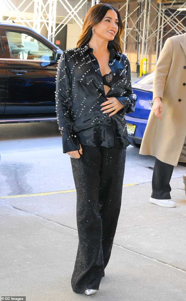 The 43-year-old performer wore a baggy, rhinestone-covered jacket over her stomach as she walked through Midtown Manhattan.