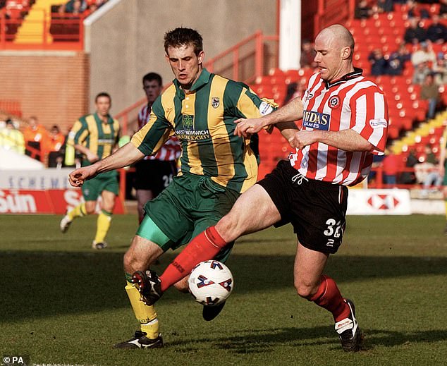 West Brom's Dobie struggles to try and win the ball back from Sheffield United's Robert Page