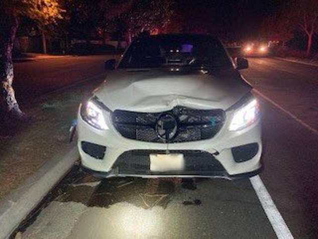 Grossman's white Mercedes SUV appears in the photo moments after the accident.