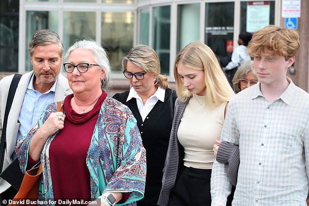 The wealthy socialite (center in photo) was accused of running over and killing two young brothers in Westlake Village in 2020.