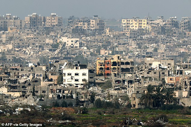 A photograph taken on Tuesday in southern Israel shows destroyed buildings in the Gaza Strip amid ongoing battles between Israel and the Palestinian militant group Hamas.