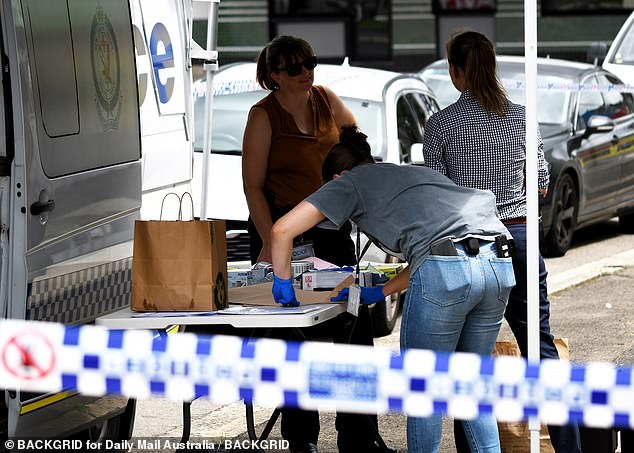 Police were led to the Taekwondo studio after discovering Mr Cho's body at a house in North Parramatta, where they allege Yoo strangled Ms Cho and the child (pictured, police at the scene).