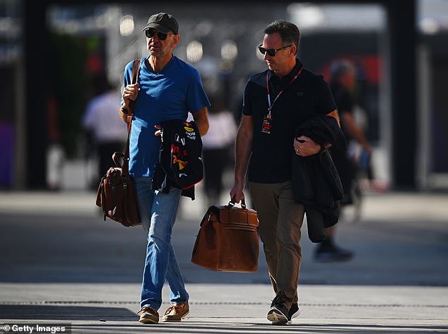 Horner was seen walking alongside Red Bull colleague Adrian Newey (left) on Wednesday.