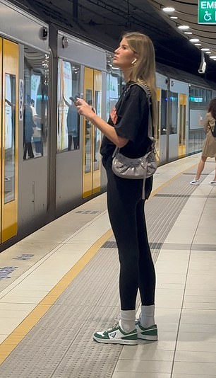 In the photo: Lauren Dunn taking a train during a break from filming without her partner.