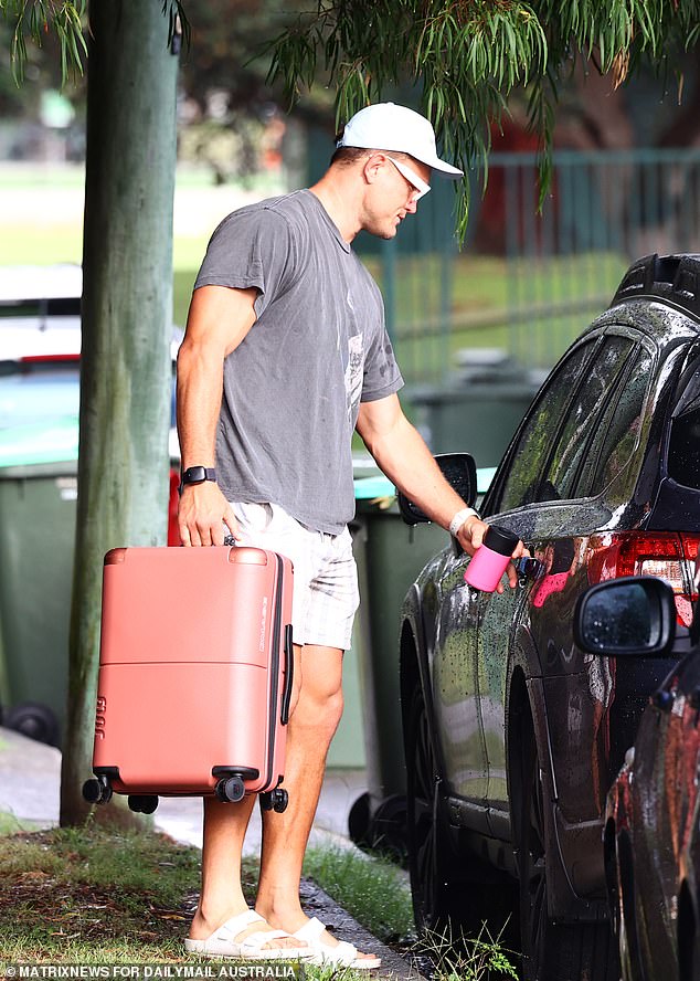 Bulldogs star Knight sported sunglasses, a t-shirt and shorts as he loaded the car.