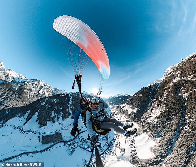Charlie works Thursday through Sunday, so the couple can usually get cheap trips the first three days of the week. Pictured: Hannah paragliding in Austria