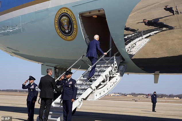Biden regained his balance and continued moving, keeping his hand on a handrail.