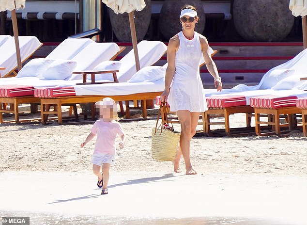 When she arrived at the beach another day, Pippa was seen wearing a white tennis dress and a matching visor.