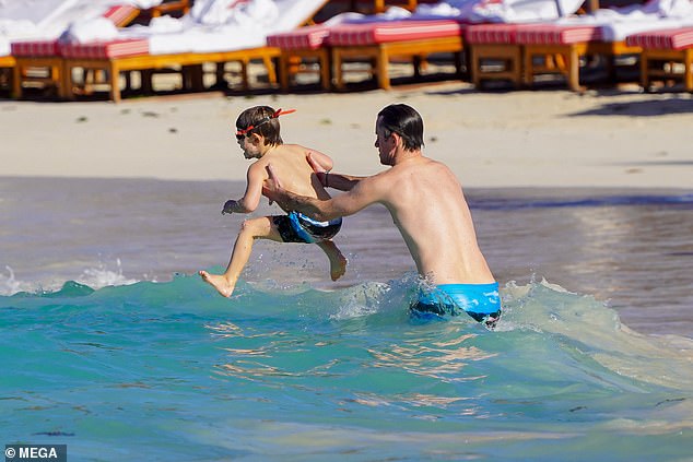 The Matthews family owns the Eden Rock resort in St Barts, one of the most exclusive hotels in the region. James Matthews photographed playing in the sea with his son Arthur