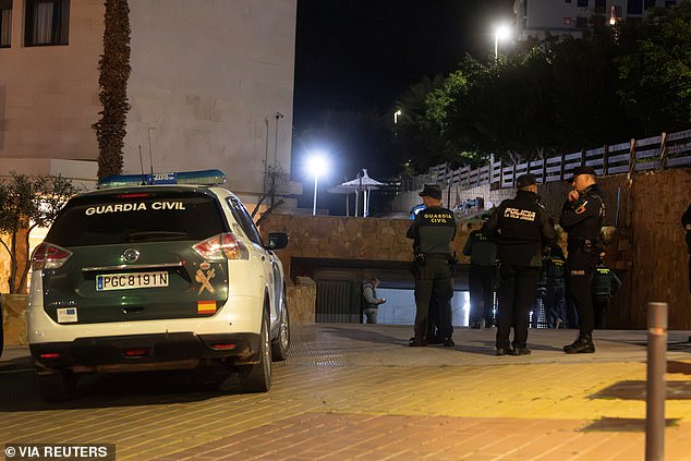 Spanish detectives have launched an investigation into the pilot's death. In the photo: Spanish Civil Guard agents in the garage where Kuzminov's body was found.