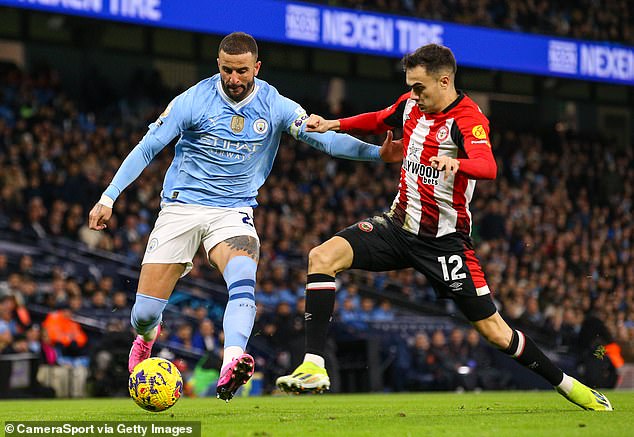 Brentford's Sergio Reguilon in action against Manchester City's Kyle Walker on Tuesday night