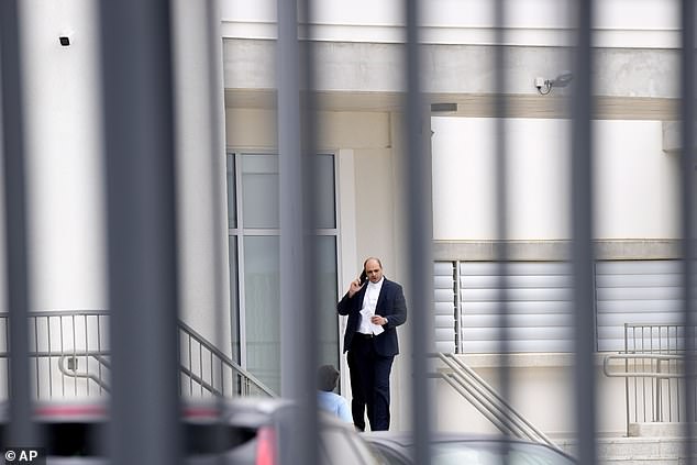 Yiannis Habaris, lawyer for three out of five Israelis, speaks on his cell phone outside the Famagusta district court in Paralimni, Cyprus, Tuesday, September 12, 2023.