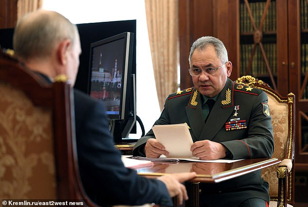 Defense Minister Sergei Shoigu is seen briefing Putin about the Russian victory at Avdiivka.