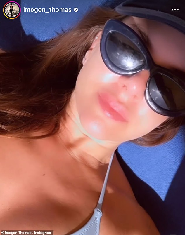 The model flaunted her jaw-dropping curves and sun-kissed tan while lounging on a sun lounger.