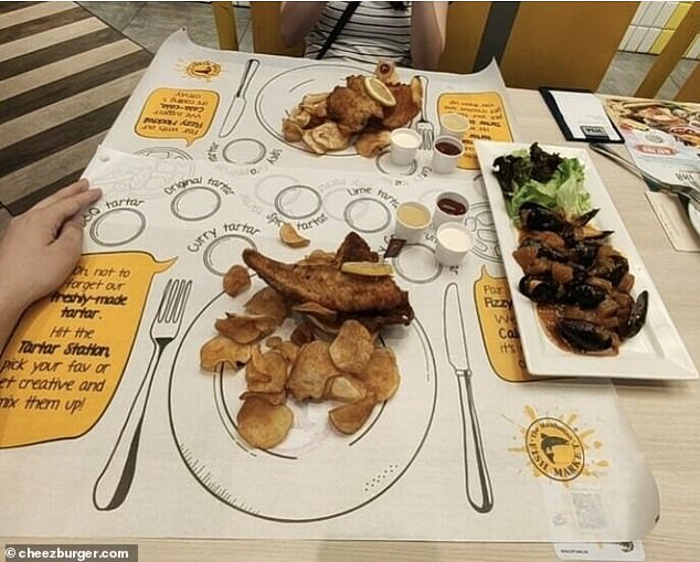 Let's hope they don't ask for curry sauce!  Elsewhere, a couple was served their fish and chips dinner on a picture of a plate and cutlery.