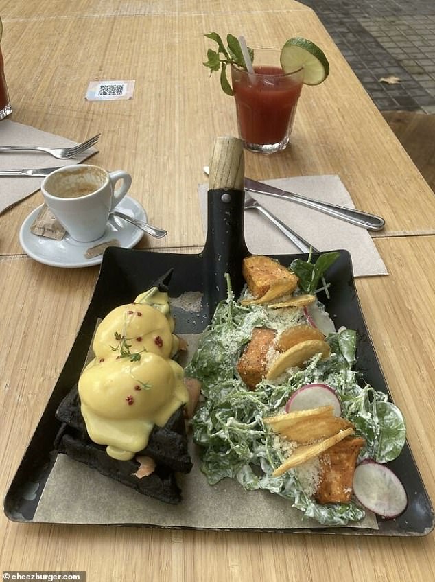 Dig in!  A bizarre snap showed another person being served eggs Benedict and salad on a garden spade.