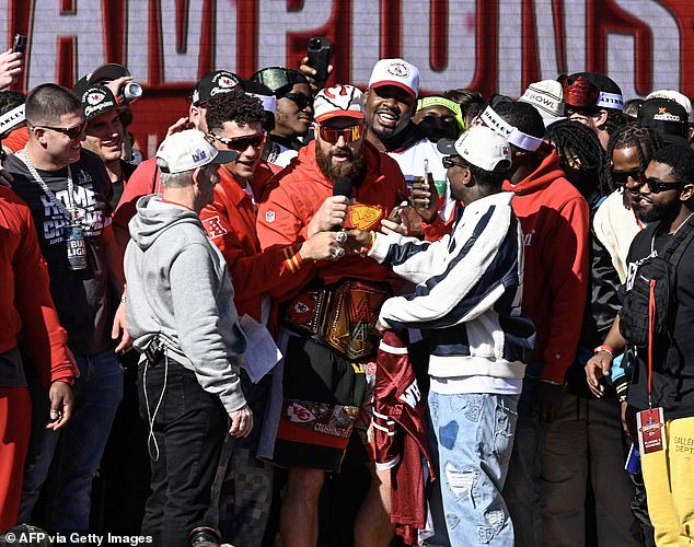 A drunk Kelce had to be stopped by his teammates while trying to sing Brooks' famous 1990 song, 'Friends In Low Places,' at the Chiefs' Super Bowl parade.