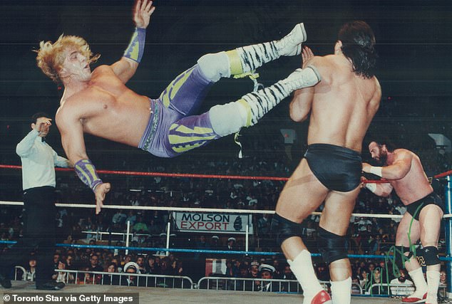 Shawn Michaels of the Rockers delivers a flying kick to Paul Roma of Power and Glory in the '90s