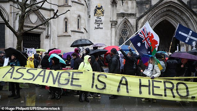 Supporters of Julian Assange protest against his extradition to the United States at the Royal Courts of Justice in London