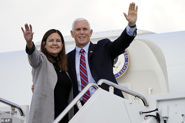 Vice President Mike Pence and Second Lady Karen Pence wave as they board Air Force Two