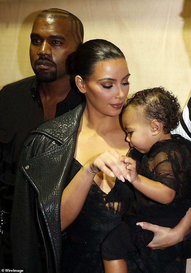 Kanye and Kim welcomed North, their first child, in 2013; photographed in Paris in 2014
