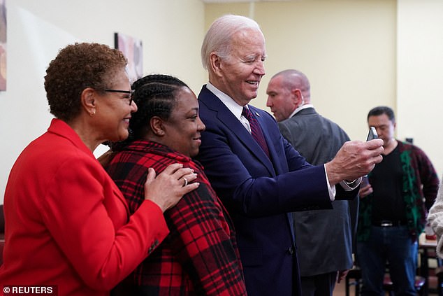 Biden, with Los Angeles Mayor Karen Bass, posed for selfies with clients and staff.
