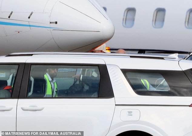 Travis was seen boarding the vehicle with his suitcases in hand as he finally landed in Sydney after huge speculation about his travel plans.
