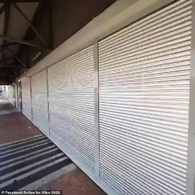 The Coles in Alice Springs after closure is fortified with metal shutters after thefts