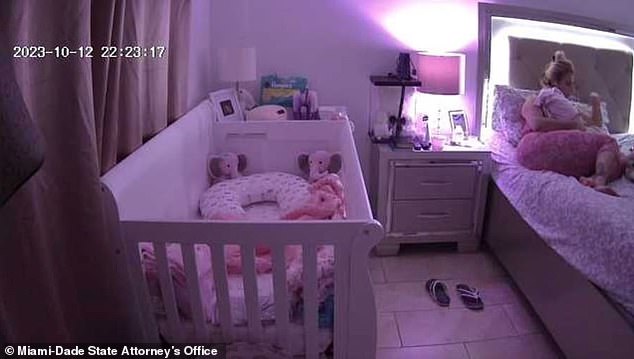 At 10:23 p.m. Irina García is seen lying in bed, cradling her 14-day-old daughter.
