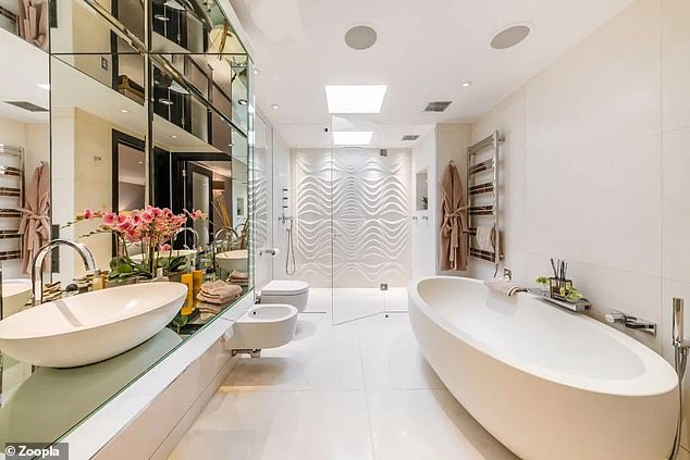 There are three bathrooms in the penthouse, including this one with a large walk-in shower.