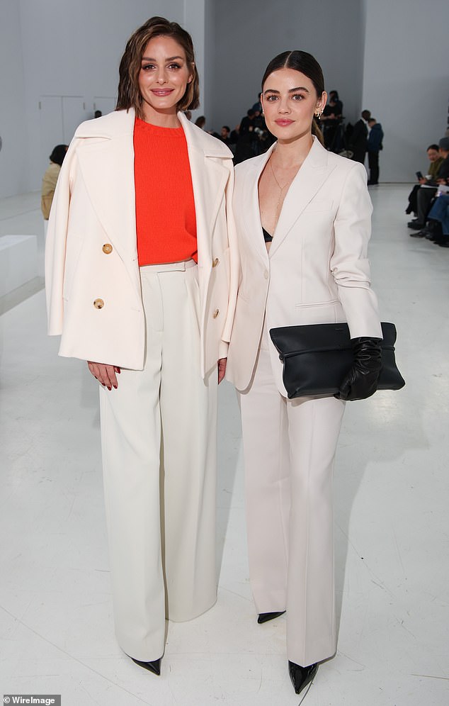 Socialite Olivia Palermo joined Lucy for photos before the show, also wearing a white suit ensemble.