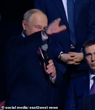 Vladimir Putin was accused today of making a 'gesture reminiscent of a Nazi salute'