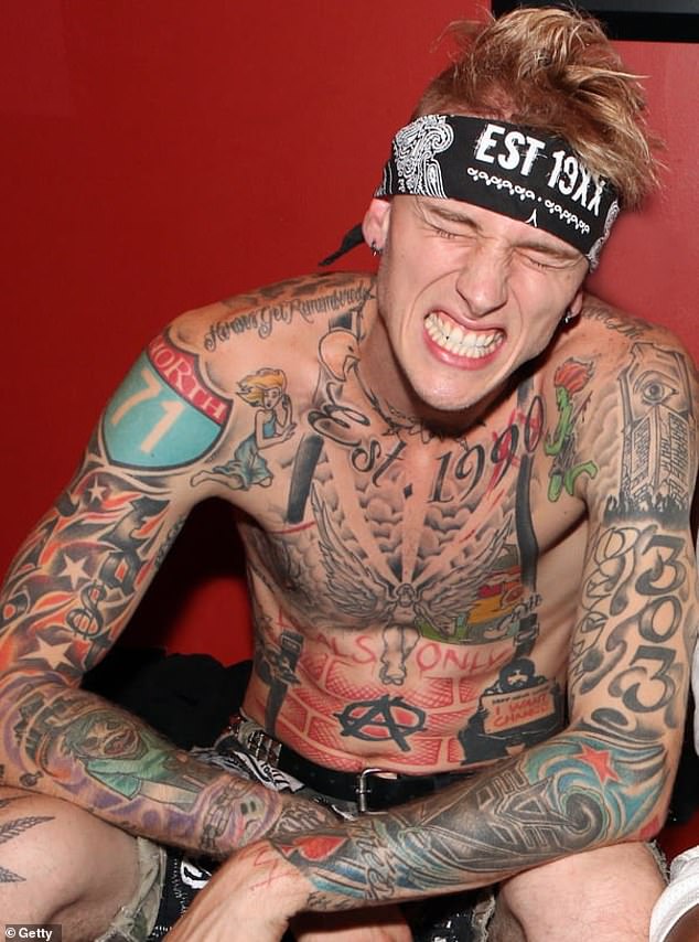 On his upper left arm, MGK has a tattoo of a clock tower with only one eye staring out as an ode to George Orwell's dystopian science fiction novel, 1984.
