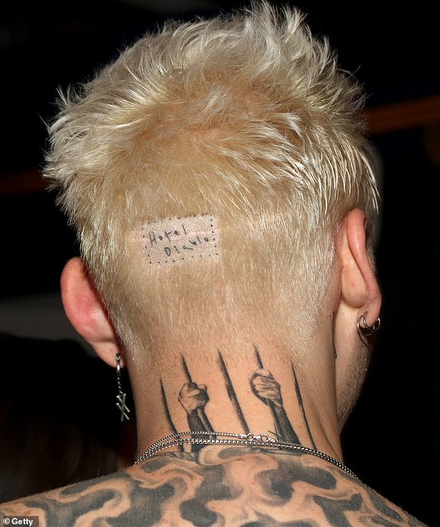Kelly got the title "Devil Hotel" inked in a dotted rectangular box on the back of his head in honor of his 2019 studio album of the same name