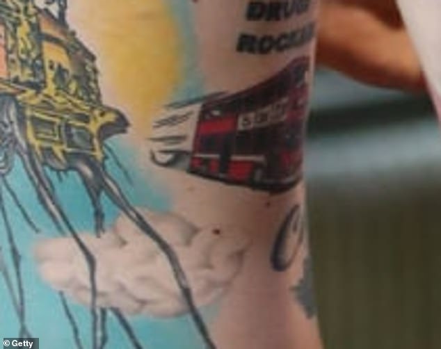 To commemorate the experience of being hit by a bus in England, MGK got a tattoo on his side of a London red vehicle, which is the most distinctive of English buses.