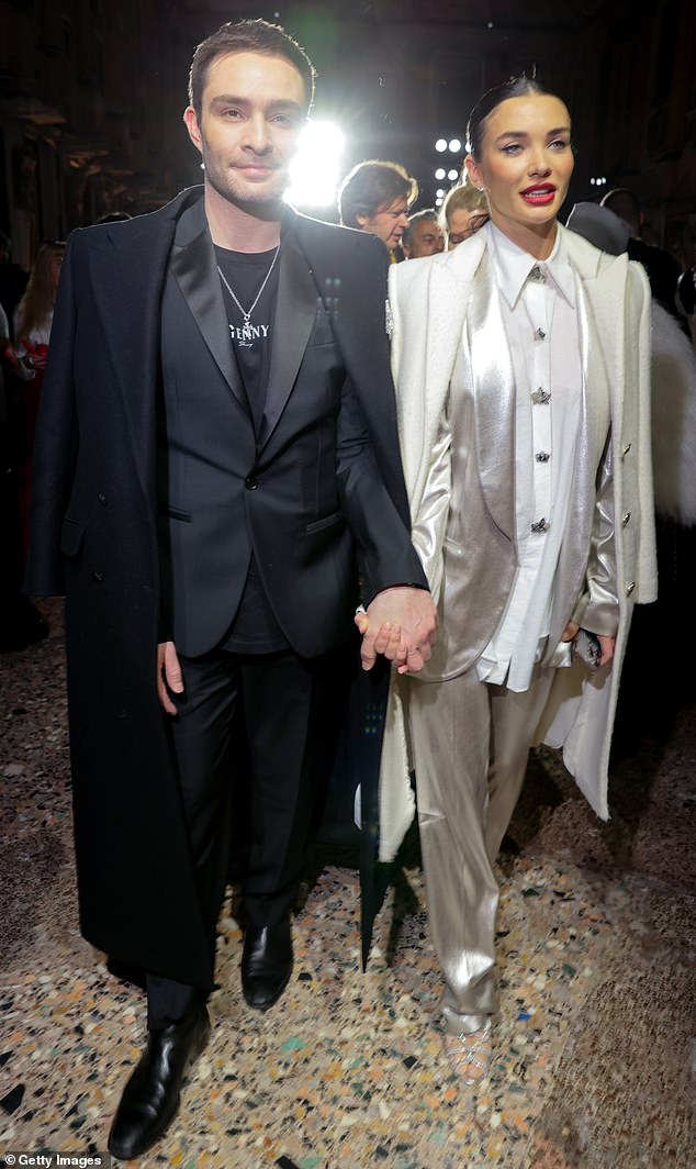 The newly engaged couple appeared at the Fall/Winter womenswear show in coordinated power suits.