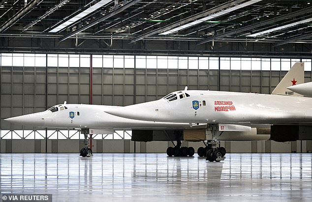 A pair of Tu-160M ​​strategic missile carriers are seen at the Kazan Aviation Factory in Kazan during a tour of the facilities by Putin on February 21, 2024.