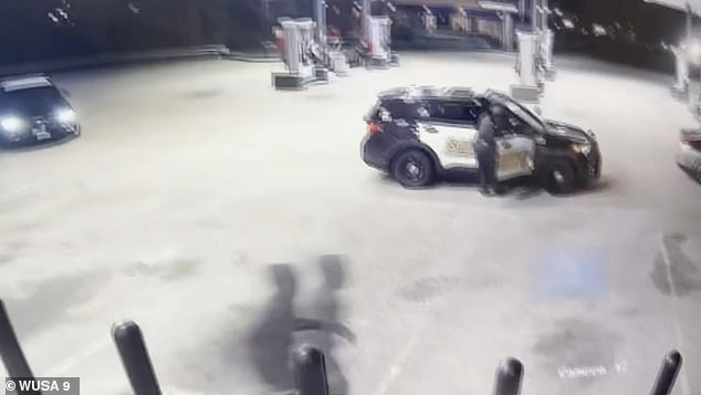 As the third robber approaches the car, the cop realizes the drama is unfolding and circles around before pulling out his gun.
