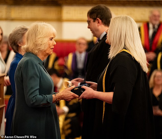 Camilla presents the Queen's Anniversary Award to representatives of Loughborough College