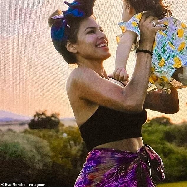 The actress also shared a rare flashback photo that showed her holding one of her daughters she shares with partner Ryan Gosling;  Together the actors have Esmeralda, nine years old, and Amada, seven years old.